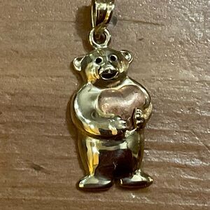 Beverly Hills Gold: 14k. Yellow gold bear holding pink/rose gold heart charm